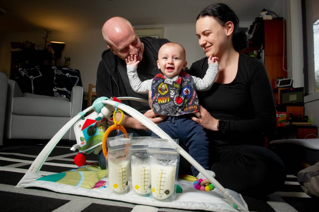 Hands up who loves breast milk? Alex Southwell and Lucy Bennett with their son Zachary Southwell, six months. Picture: Elsa Kurtz