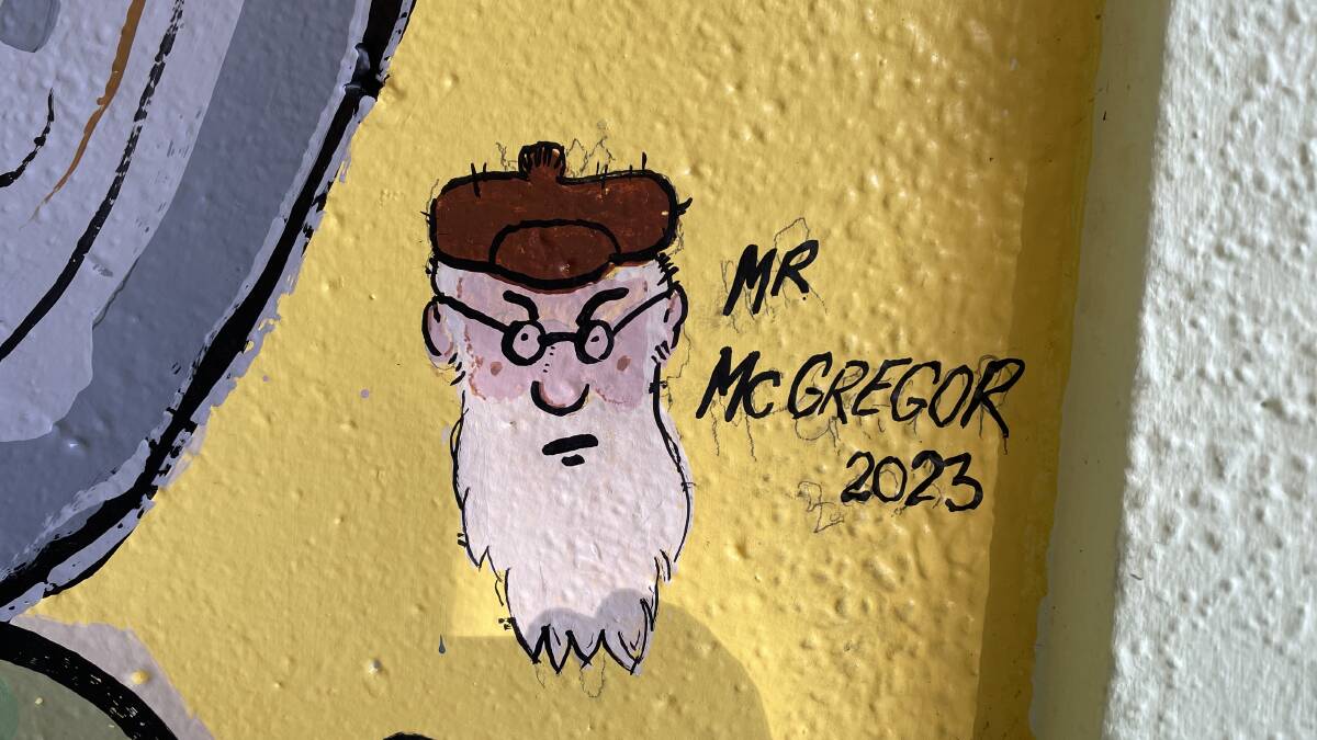 The signature of Mr McGregor in the bus shelter.