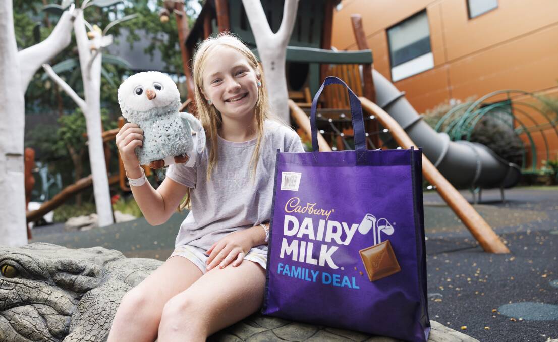 Canberra Hospital patient Chelsea Cowie, 10, of Ngunnawal, with her chocolate showbag. Picture by Keegan Carroll 