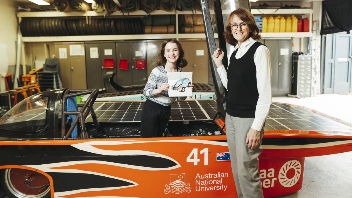 Canberra's Evelyn Fox meets Australia's chief scientist Dr Cathy Foley in the workshops of the ANU solar racing team. Picture: Dion Georgopoulos 