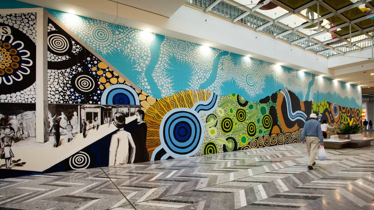 The new mural in the Canberra Centre has been driven by local artist Geoff Filmer and 2022 NAIDOC artist of the year Leah Brideson. Picture by Elesa Kurtz