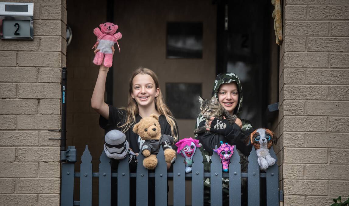 Kambah sisters Lucy and Hannah Smit, 12, of Kambah, with their contribution to the bear hunt. Picture: Karleen Minney.