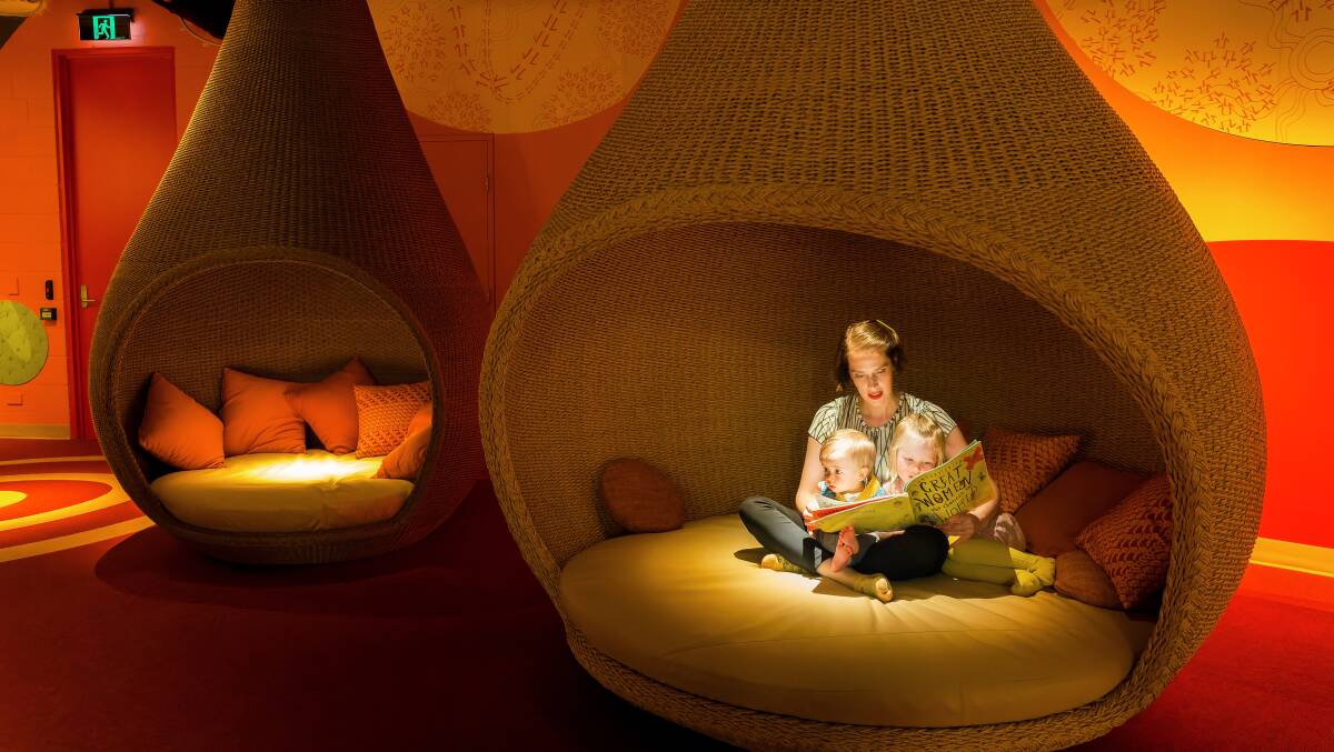 Hannah Richardson and her children Cormac Asmus, 1, and Elowen Asmus, 4, in the reading pods which are supposed to resemble being in a kangaroo pouch. Picture by Sitthixay Ditthavong