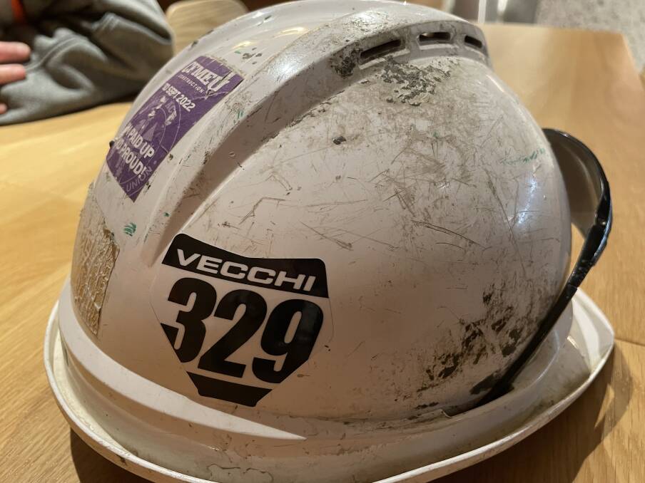 Workmate Leigh Radburn now wears Mr Vecchi's race number 329 on his hard hat as a tribute to the young father and good mate. Picture: Megan Doherty