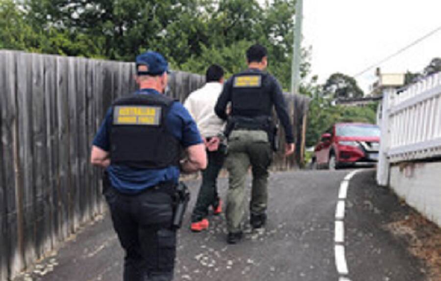Australian Border Force officers arresting a 28-year-old man in Tasmania. Picture: ABF