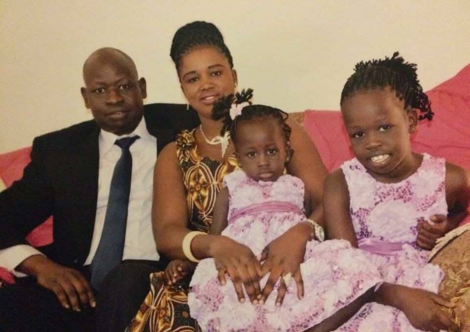 The deceased man, Abot Mabil Derwei, aged 34, with his wife, Aduk Monydhot Majock, and two of their four children. Picture: Supplied