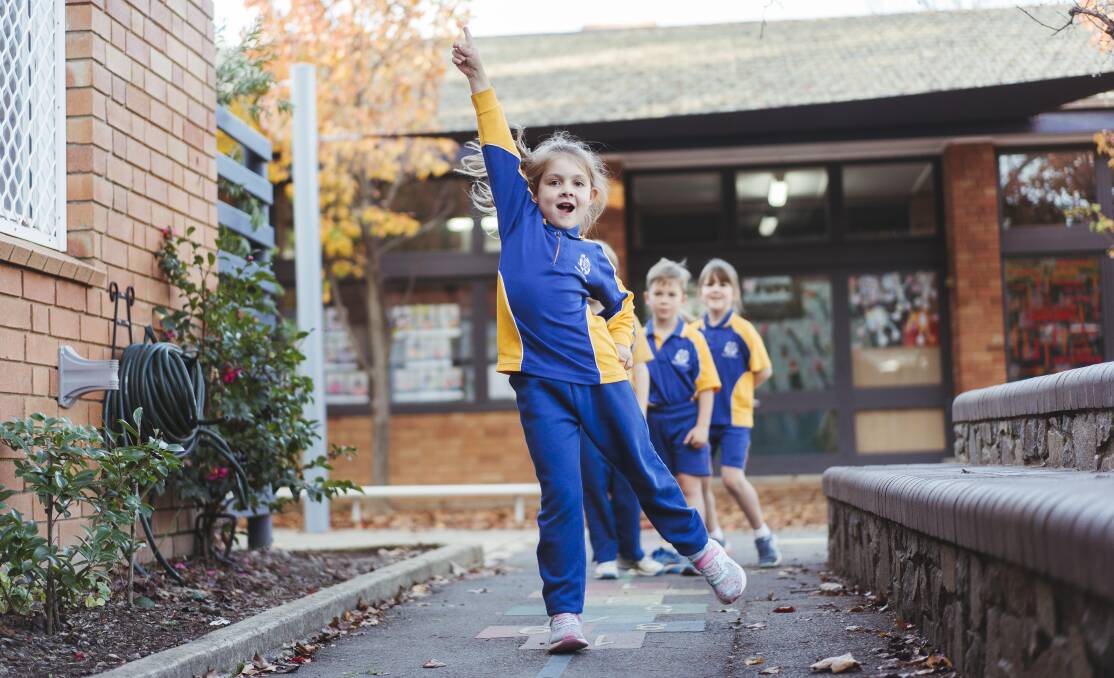 St. Bede's Primary School student Lily, 7, plays hopscotch with her peers. Picture: Dion Georgopoulos