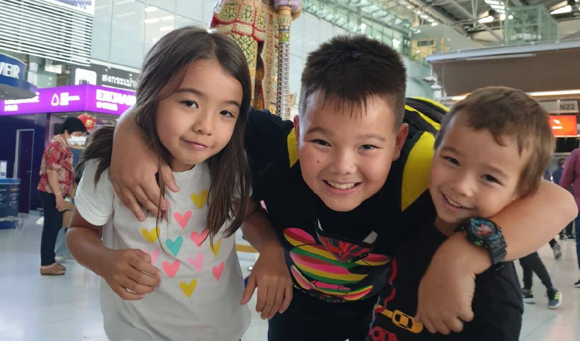 Oscar, centre, with his sister, Taani, and brother, Sam, in Bangkok airport at the beginning of this year. Picture: Supplied