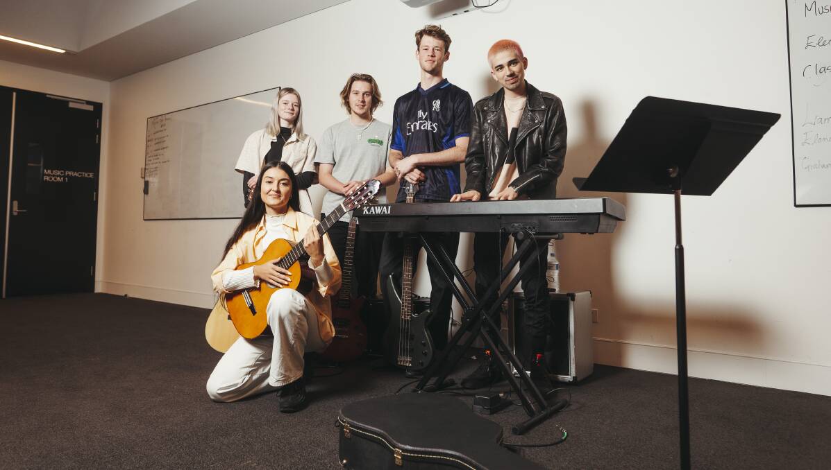 Canberra College students Lucinda Drabsch, Andre Cheyne-Dobrowolski, Jack Boxshall had to write a song in one day with music artists Milan Ring and Taka Perry. Picture: Dion Georgopoulos