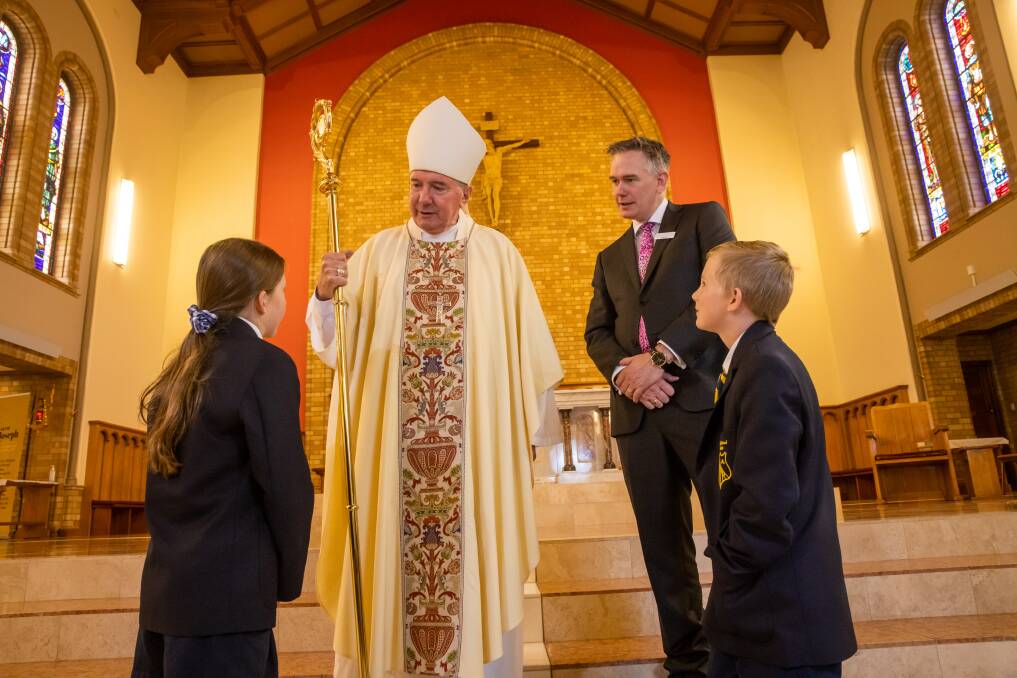 St Joseph's Primary School Bombala student leaders Miller Stewart, 11, and Connor Reed, 11, met Archbishop Christopher Prowse and Catholic education director Ross Fox after a mass celebrating 200 years of Catholic Education at Saint Christopher's Cathedral. Picture: Keegan Carroll