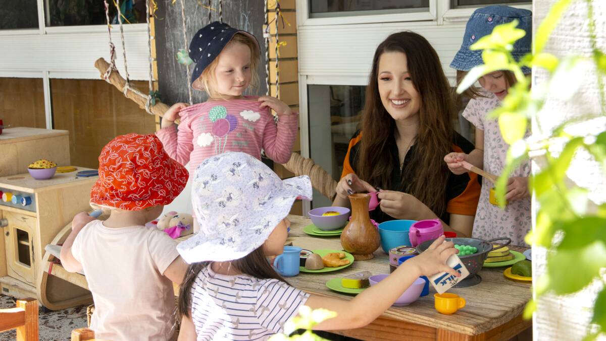 An educator with children at Communities@Work Greenway Child Care and Education Centre. Childcare centres remain open during the lockdown for children of essential workers and vulnerable children. Picture: Supplied