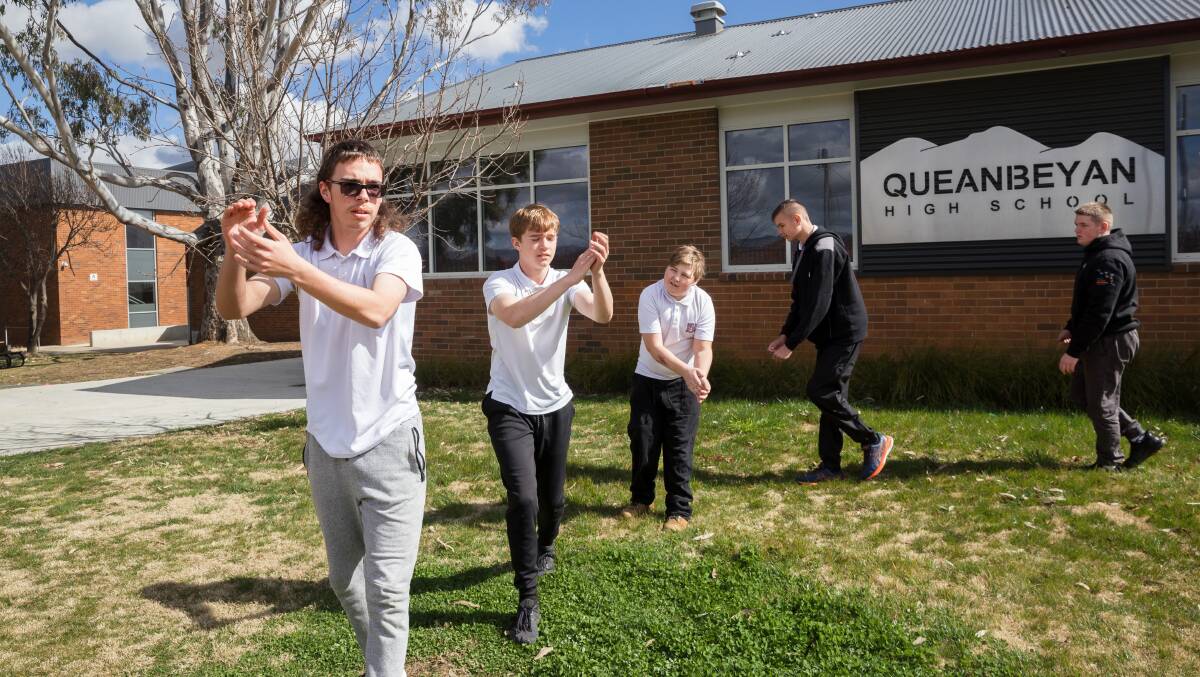 Queanbeyan High School students Tyson Russell, Logan Russell, Damien Dowton, Thomas Russell and Damon Laws re-enact the bogong dance, which features in a new anti-smoking advertisement. Picture by Sitthixay Ditthavong