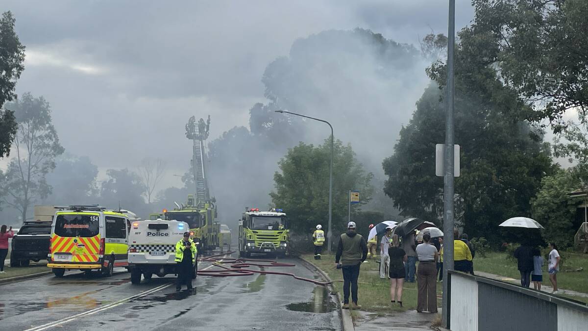 Emergency crews respond to a house fire in Kambah. Picture by Megan Doherty
