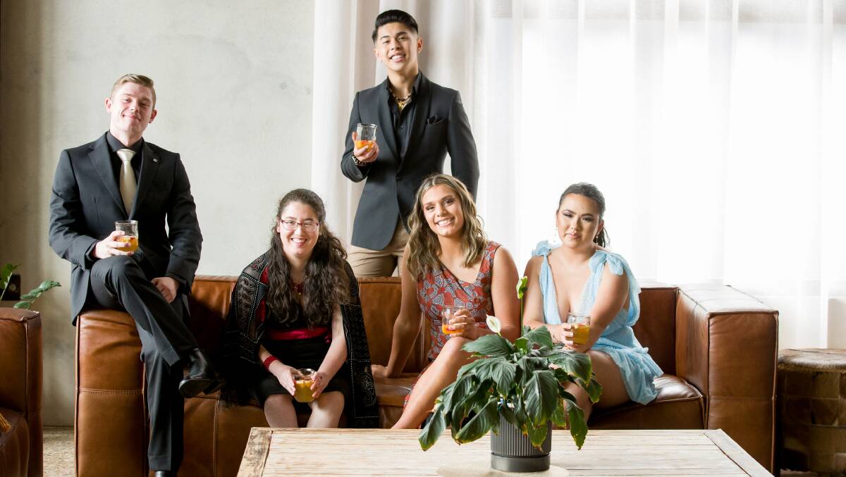 Dickson College students Chris Fladun-Dorling, Megumi Kawada, David Nguyen, Georgie Jaques and Rebekah Kim relax before their formal night. Picture: Sitthixay Ditthavong