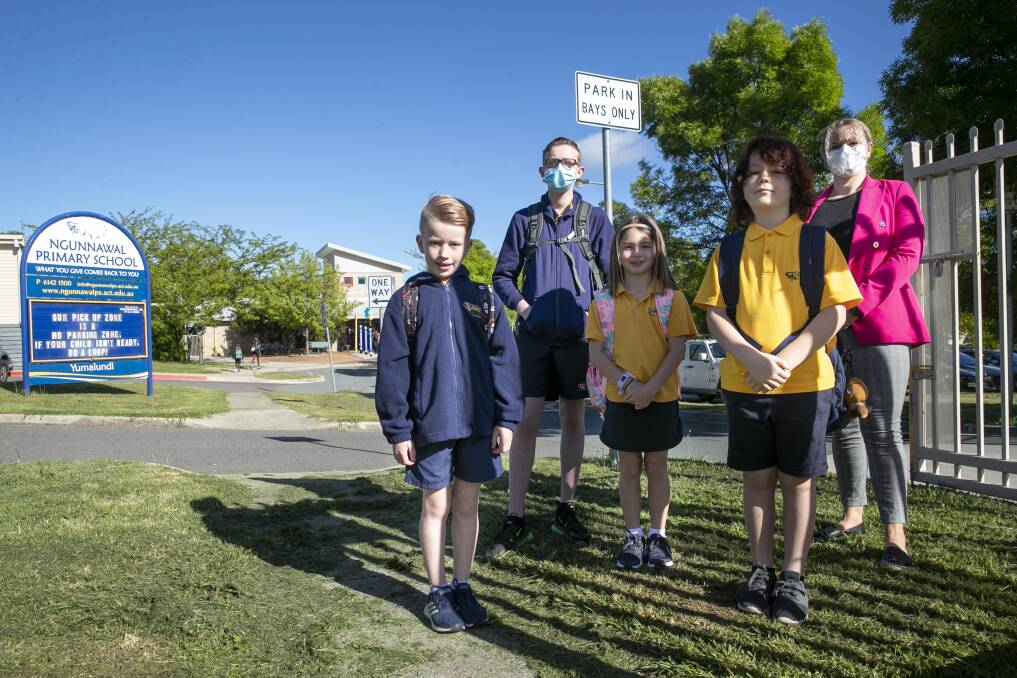 Ngunnawal Primary School students Arlo Baker, Ayden Hirst, Hazel Potts and Finlay McConaghy with school principal Rebecca Turner excited to be back on school grounds. Picture: Keegan Carroll