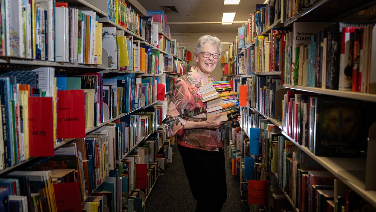 Emeritus Professor Belle Alderman amid the collection of 58,000 Australian children's literature and ephemera. Picture by Karleen Minney