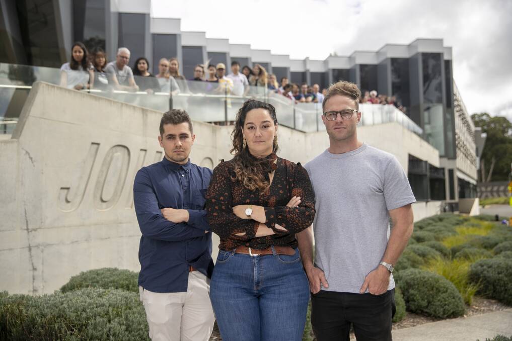 ANU postdoctoral researcher Dr Shaam Al Abed and phd students Nathan Reynolds and Dan Palmer are angry with the plans to remove their specialisation of neuroscience. Picture: Keegan Carroll