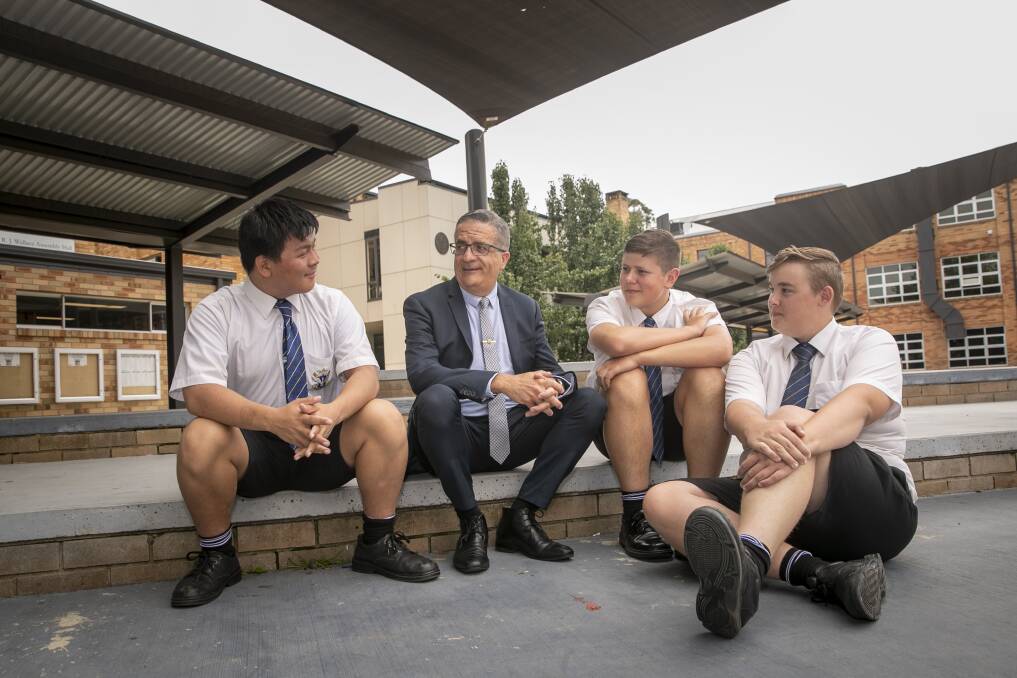 St Edmund's College principal Joe Zavone speaks with students Aaron Ciuffetelli, Kelven Ng and Zac Smith about consent in light of recent allegations at Parliament House and the online petition started by Sydney schoolgirls. Picture: Keegan Carroll