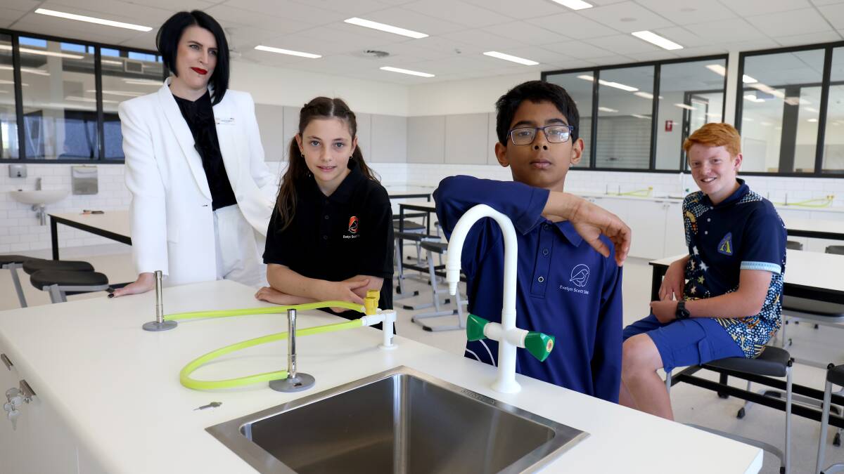 Evelyn Scott School principal Jackie Vaughan in the new science labs with year six students Ava Wheatley, Abram Thomas and Sam Moffatt. Picture by James Croucher