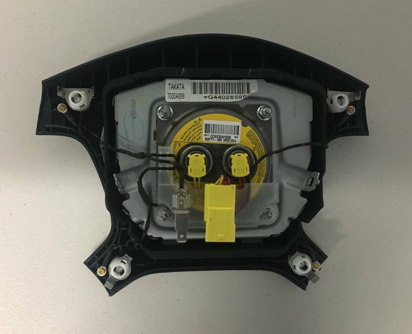 The reverse side of a steering wheel boss, showing the faulty Takata explosive charge which could send shards of metal into the driver. Picture: Peter Brewer.