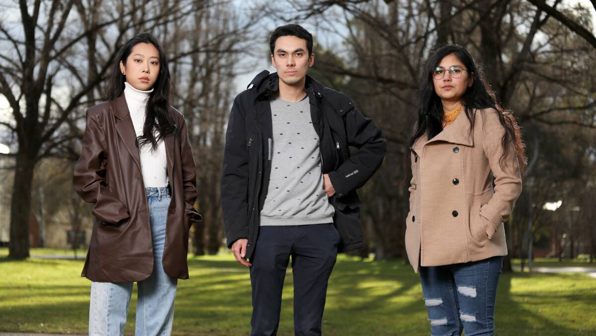 PARSA women's officer Nancy Zhang, acting vice-president Tristan Yip and higher degree research officer Gunjan Dixit are disappointed ANU has decided to defund the organisation next year. Picture: James Croucher