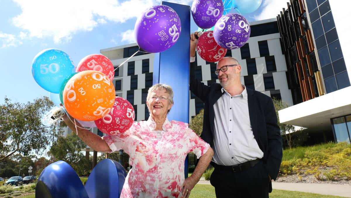 Former graduate Coralie Amos and executive dean of education Barney Dalgarno celebrated the faculty's 50th anniversary. Picture: James Croucher