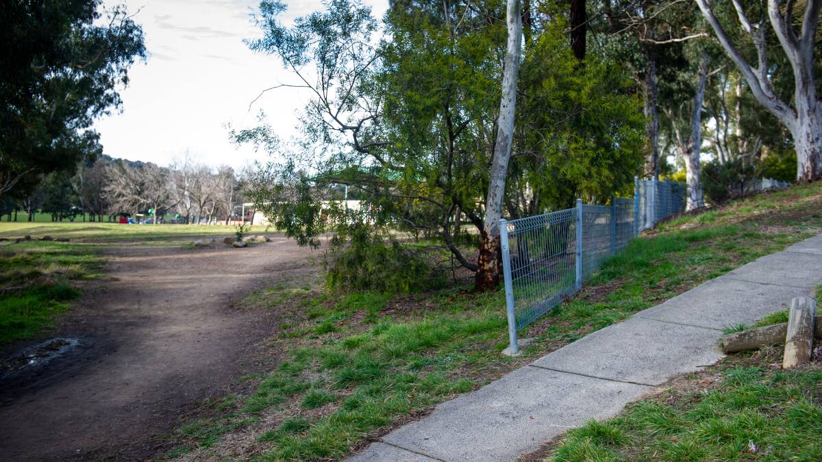 Gap in the fence surrounding Aranda Primary School where students can potentially walk off grounds. Pictures: Elesa Kurtz
