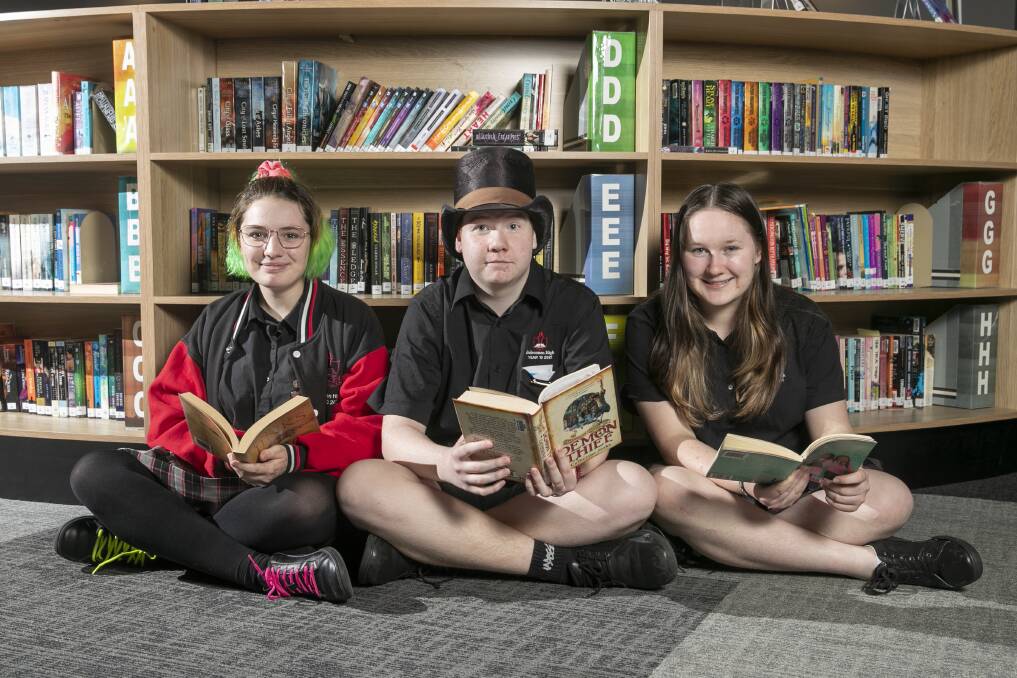 Belconnen High School students Sienna Griffiths, Kaelan Olds and Brianna Boyes in the central library. Picture: Keegan Carroll