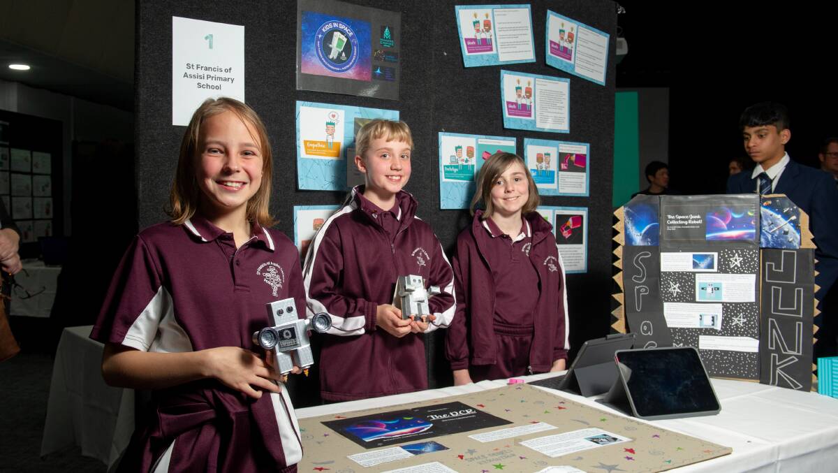 St Francis of Assisi Primary School year 5 students, Scarlett Fuller, 11, Khya Wall, 10 and Annabelle Baker, 11 with their space debris robot. Picture by Elesa Kurtz