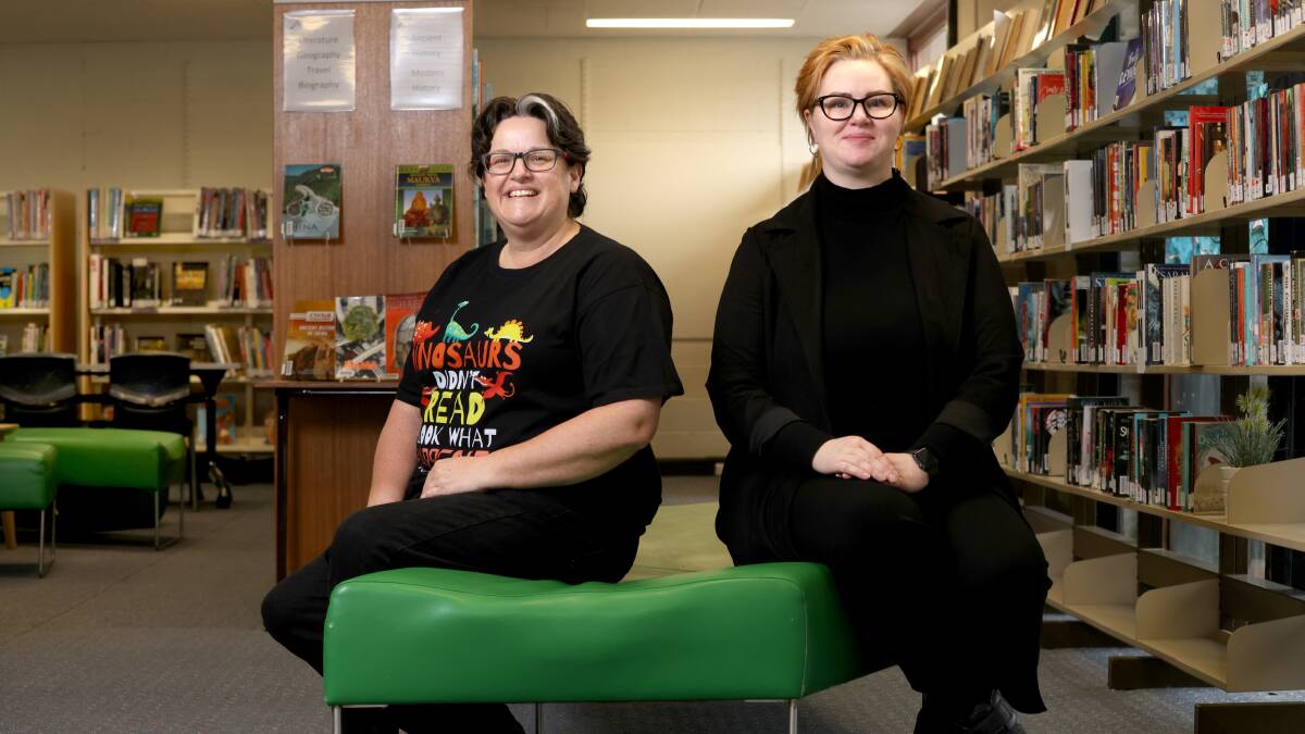 Melba Copland Secondary School teacher librarians Lisette Robey and Mali Jorm in the high school library. About 80 per cent of books they purchase have been requested by students. Picture: James Croucher