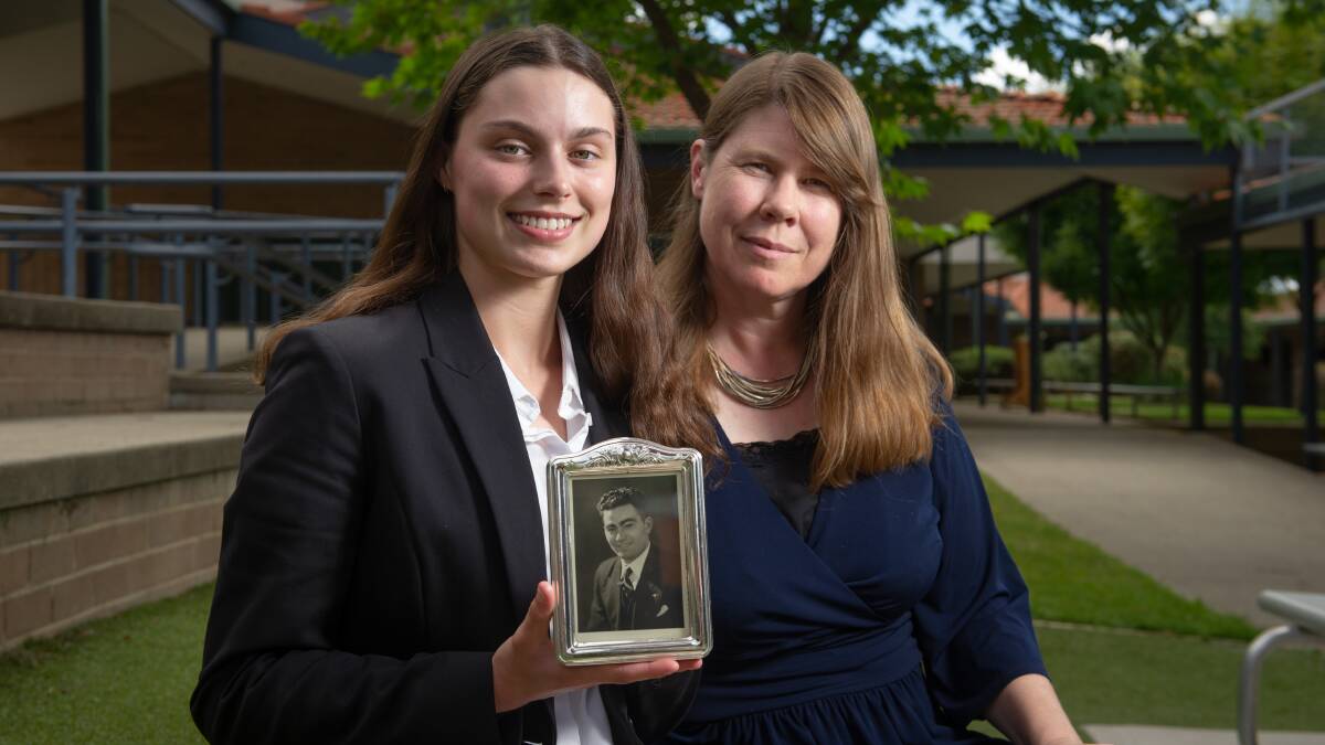 Former student Rachel Maruskanic with a picture of her great-grandfather, Philip Kleine, who survived the Holocaust and brought his family to Australia after the war, and Covenant Christian School teacher Jocelyn James. Picture: Elesa Kurtz