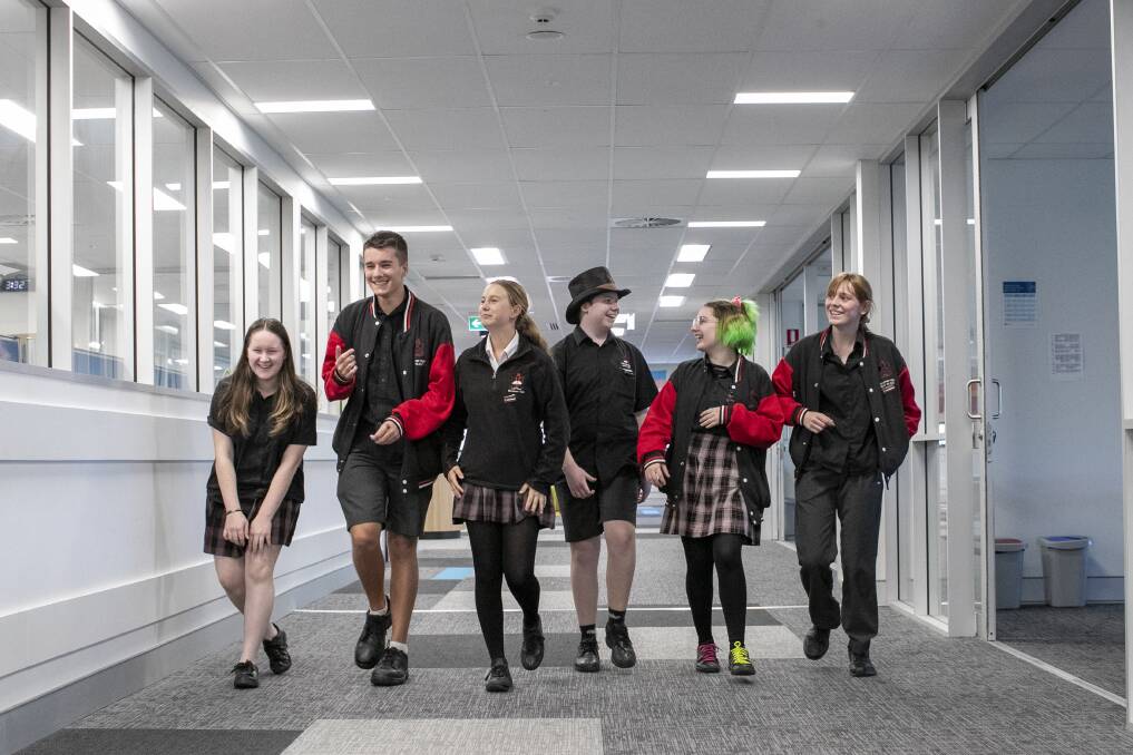 Above: Belconnen High School student leaders Sienna Griffiths, Kaelan Olds, Brianna Boyes Grace Ferguson, Lachlan Gleeson and Cassie De Jong led tours to celebrate the 50th anniversary of the school. Left: Photos of the school campus in the early 1970s. Picture: Keegan Carroll