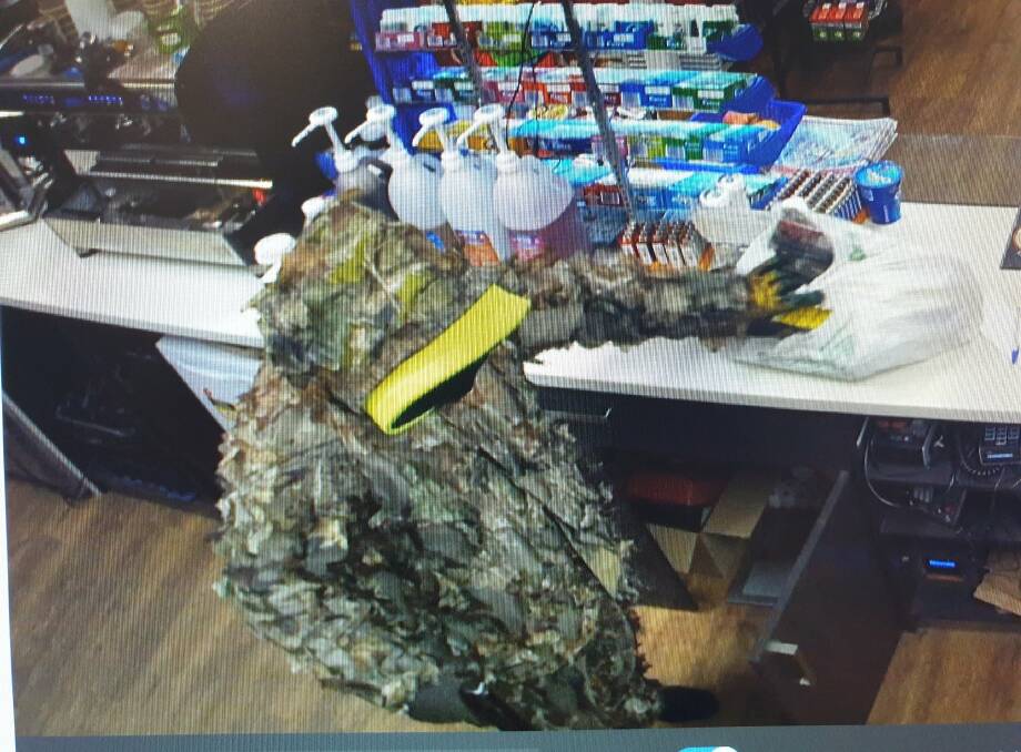 Police say a man wearing this suit robbed a Mogo service station on Wednesday. Picture: NSW Police