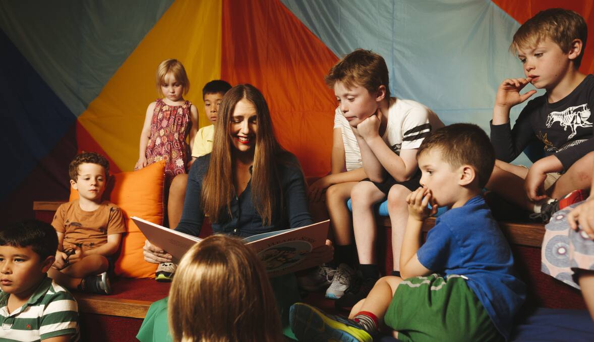 Artist Piccinini reads her book 'Every Heart Sings' to a group of children at the National Gallery of Australia on Thursday. Picture: Dion Georgopoulos