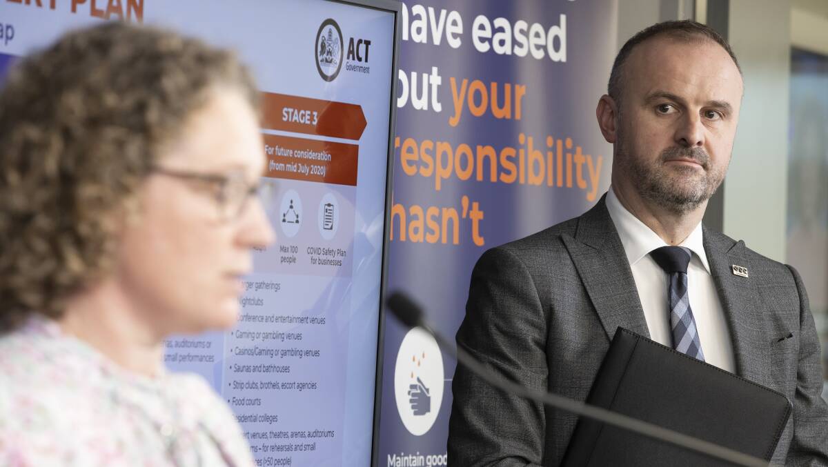 Chief Minister Andrew Barr, right, watches on as chief health officer Dr Kerryn Coleman addresses the media. Picture: Sitthixay Ditthavong