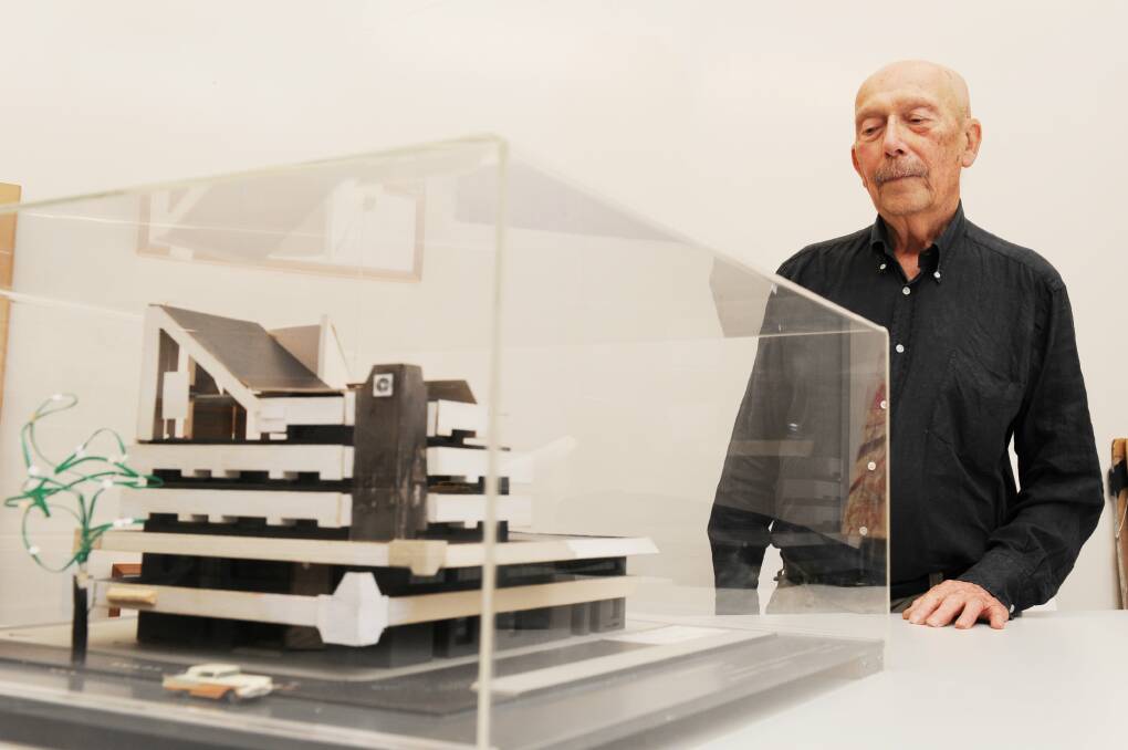 Architect Enrico Taglietti with a model of the iconic Cinema Center building in 2012. Picture: Rohan Thomson