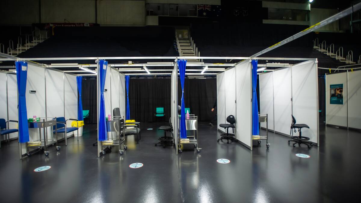 Partitions as part of the mass vaccination clinic have been installed on the AIS Arena floor. Picture: Karleen Minney