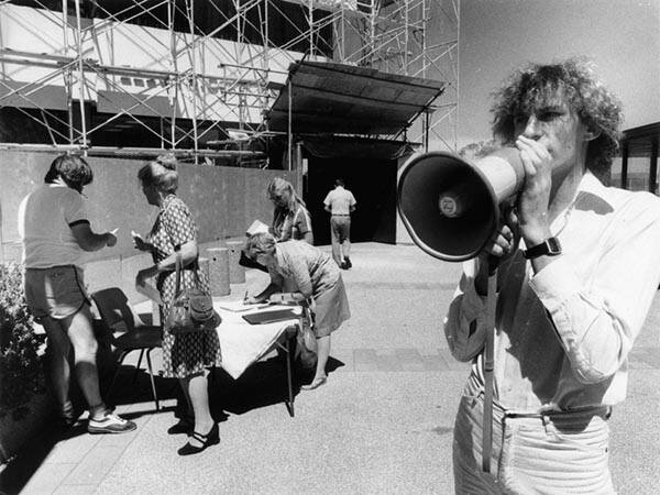 Ian Fry, right, gathers signatures in support of saving the Capitol Theatre in 1980. Picture: Michael Porter (ACT Heritage Library/Canberra Times collection)