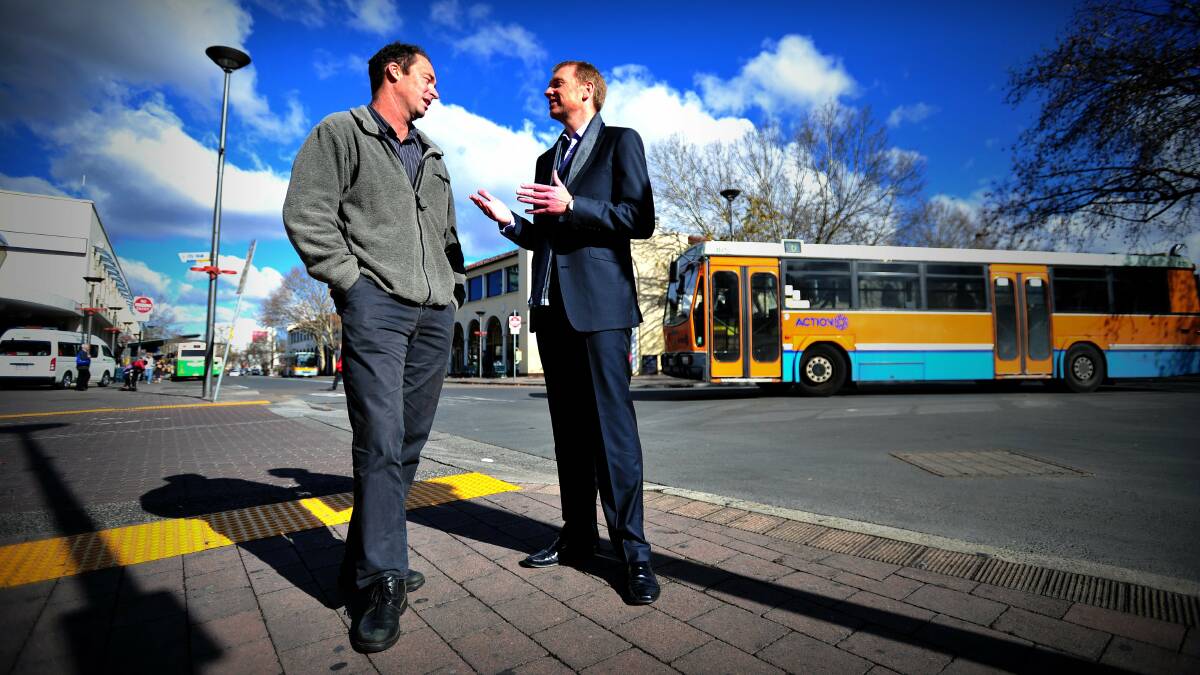 ACT Transport Workers Union sub-branch secretary Klaus Pinkas with ACT government minister Simon Corbell in the Civic Bus Interchange to announce the next phase of finalising the enterprise agreement for ACTION bus drivers in July 2011. Picture: Karleen Minney