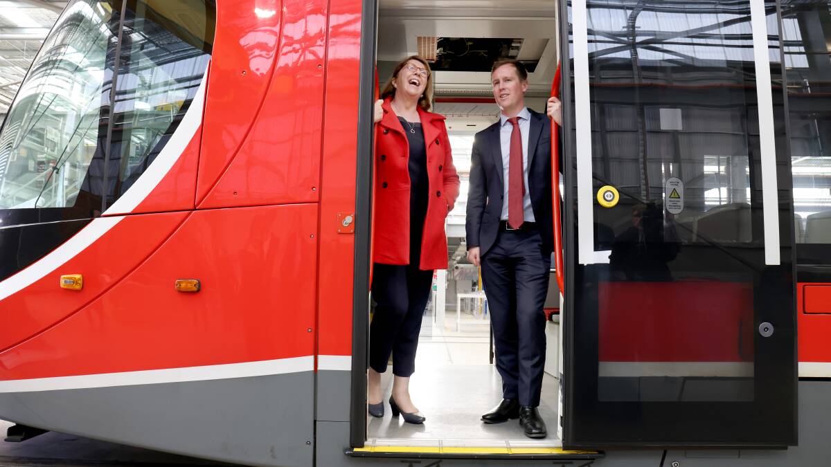 Federal Infrastructure Minister Catherine King with ACT Transport Minister Chris Steel on a light rail vehicle at the Mitchell depot in August. Picture by James Croucher