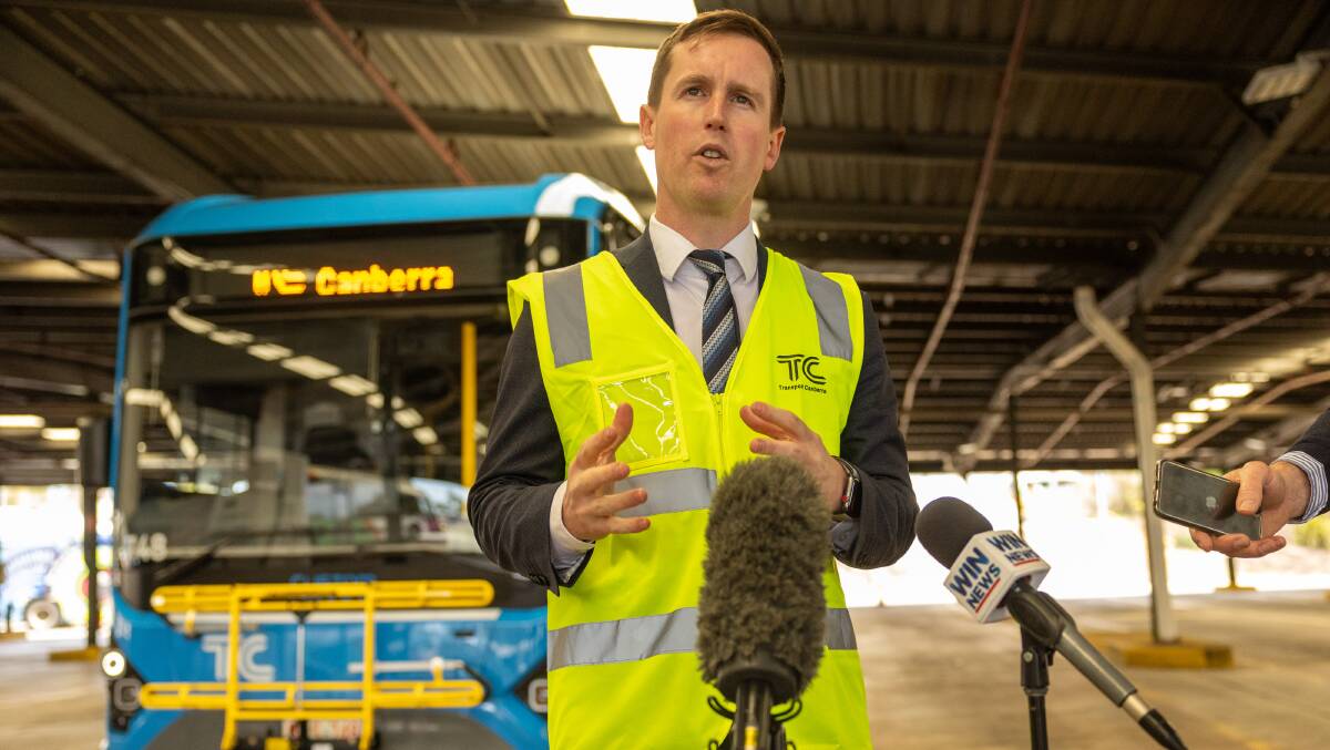 Mr Steel gives a press conference at the Belconnen bus depot in October 2023 with a bus that has still not entered service. Picture by Gary Ramage