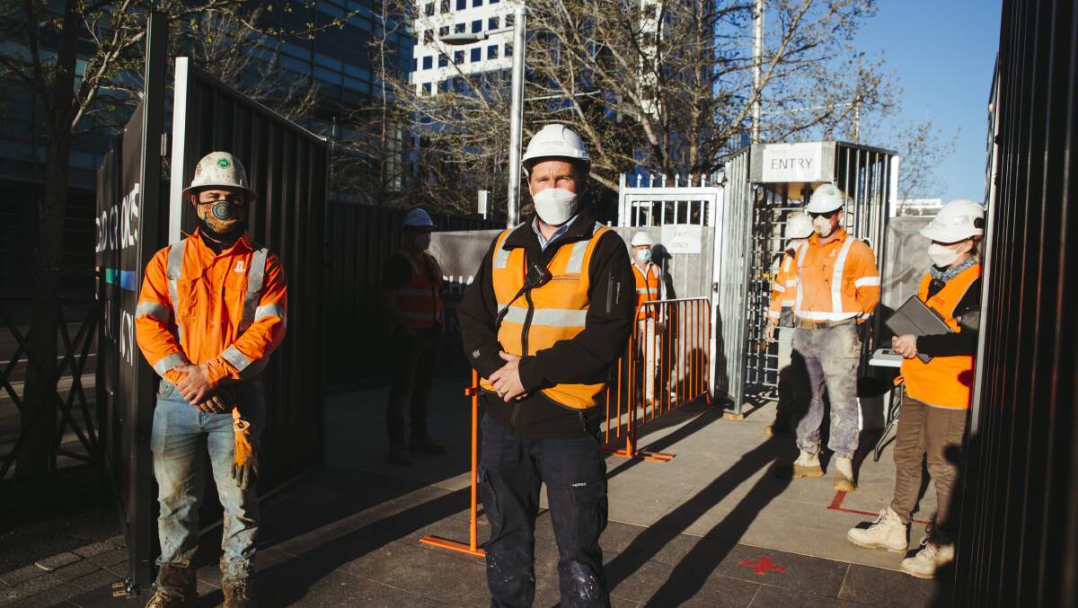 Richard Crookes Constructions site manager Shane Noye, pictured with colleagues at their Civic construction site, where they are obeying COVID rules. Picture: Dion Georgopoulos