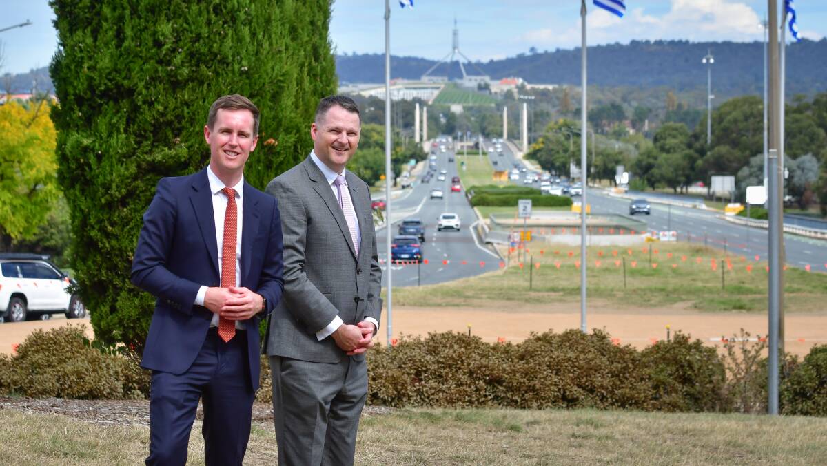 Transport Minister Chris Steel, left, and Major Projects Canberra's Duncan Edghill stand in front of Commonwealth Avenue bridge. Picture: Elesa Kurtz
