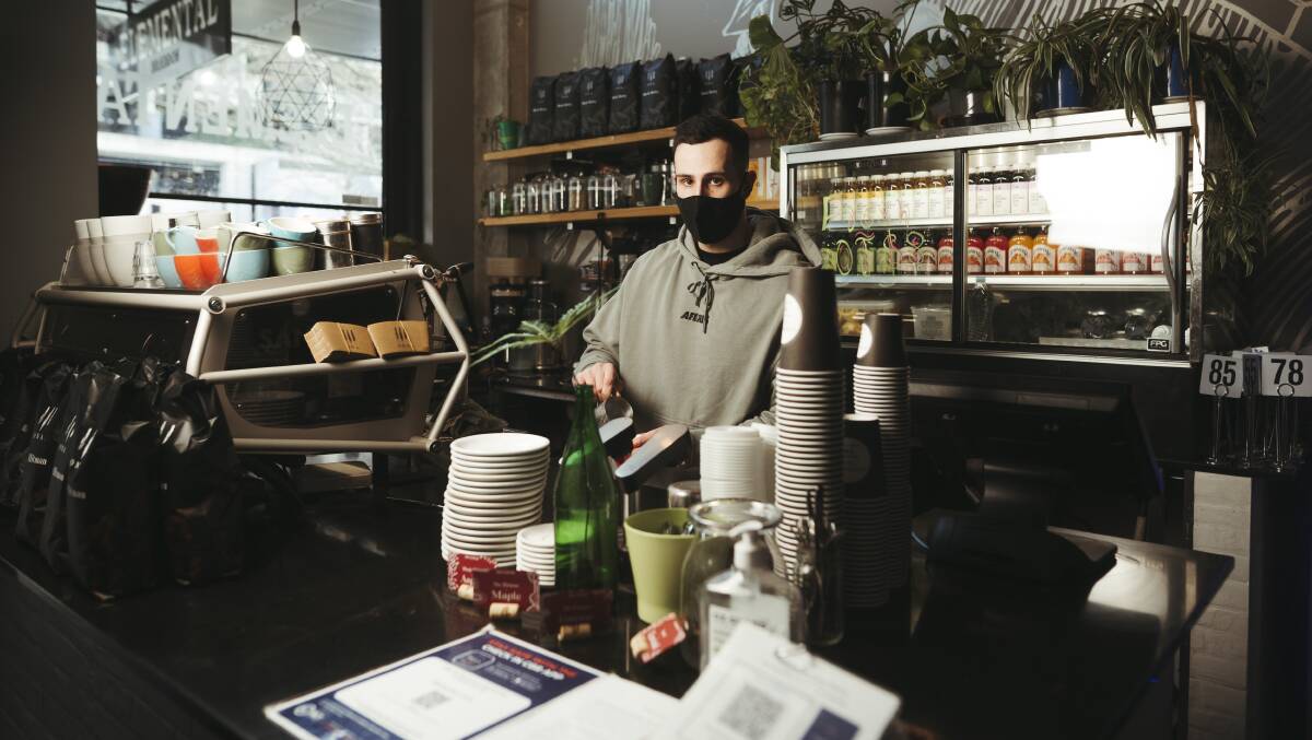 Julian Fresi, owner of Elemental Cafe in Braddon says business has dropped dramatically since Sydney's COVID outbreak. Picture: Dion Georgopoulos