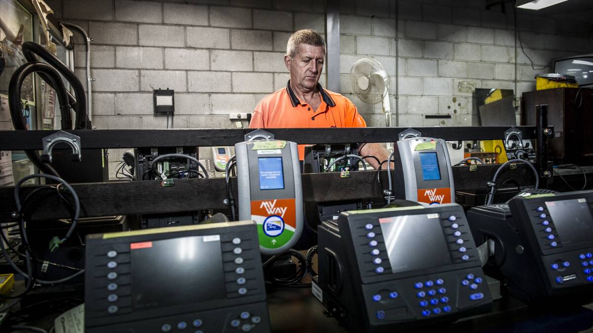 Technical officer Hector Steele with parts of the MyWay system at the ACTION buses Belconnen depot in April 2012. Picture by Rohan Thomson