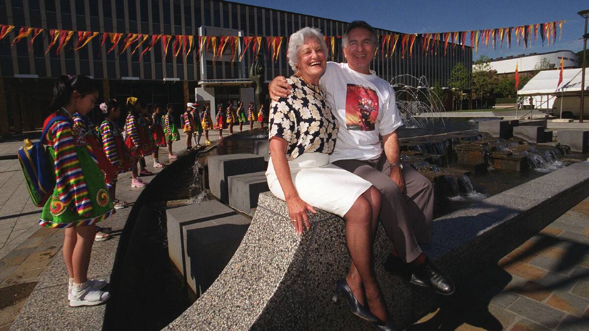 Domenic Mico, right, with Elizabeth Grant in Civic Square, as directors of the Multicultural Festival and Canberra Festival in 2000. Picture by Graham Tidy