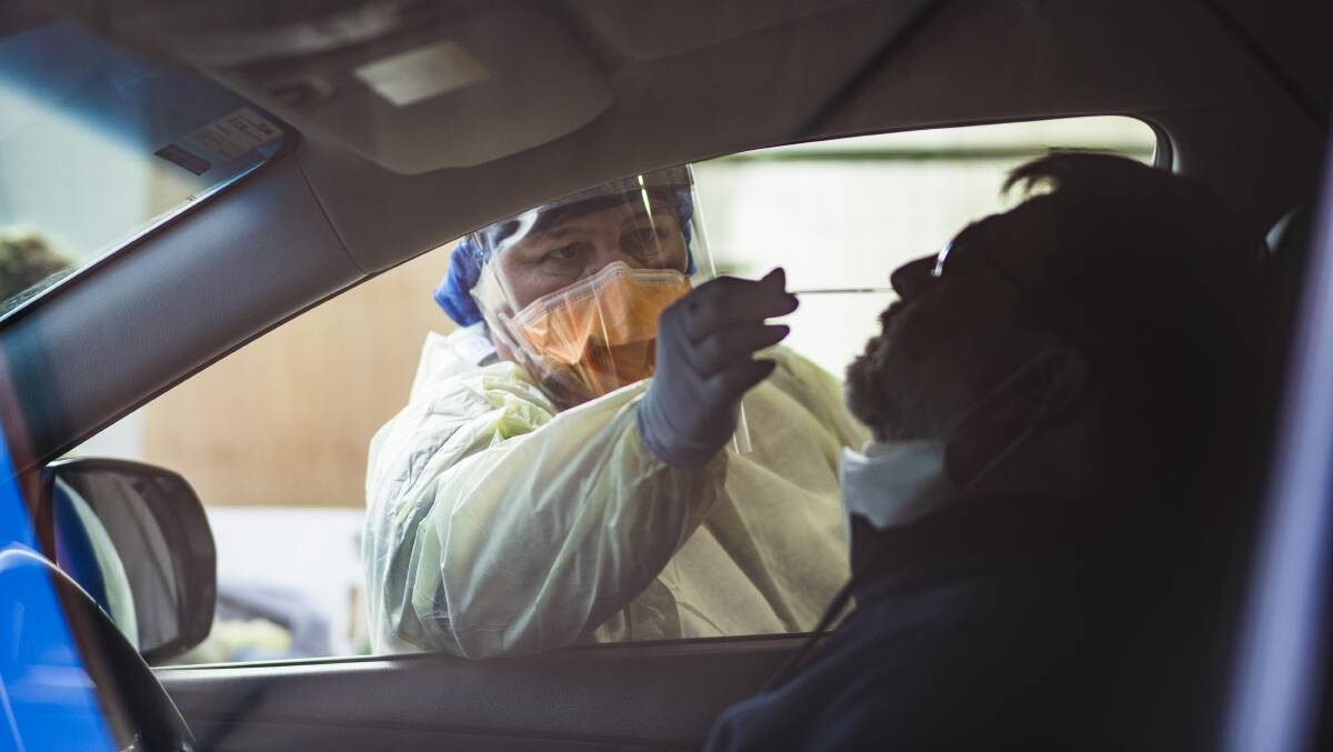 Head nurse Lauren Parker conducts a COVID-19 test at a drive-in site in Kambah on July 30, 2020. Picture by Dion Georgopoulos