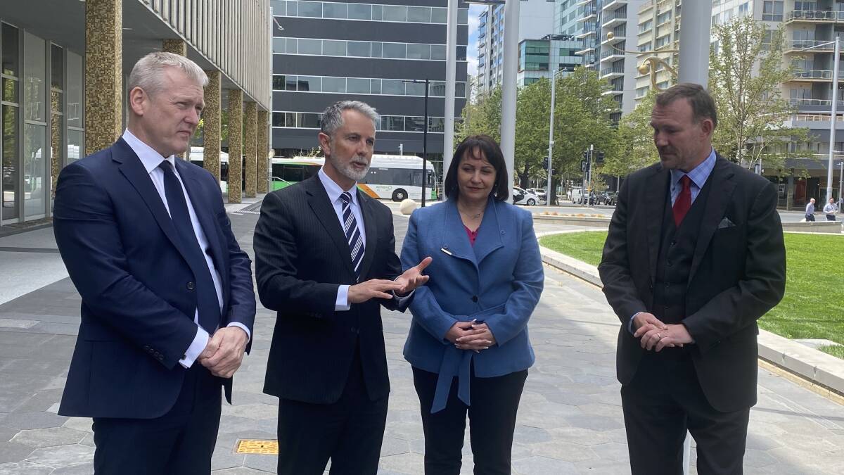 Andrew Corney, Deputy Opposition Leader Jeremy Hanson, Janice Seary and Tom McLuckie speak outside the Legislative Assembly on Tuesday. Picture by Jasper LIndell