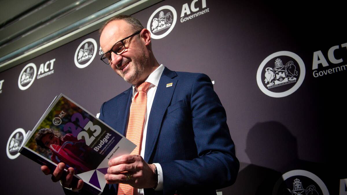 Chief Minister Andrew Barr reads the 2022-23 ACT budget papers earlier this month. Picture: Elesa Kurtz