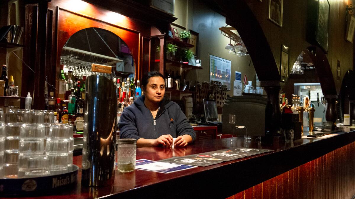 The Pot Belly's Amreesh Toor behind the bar of the struggling Belconnen venue, which would welcome government support, on Tuesday. Picture: Elesa Kurtz